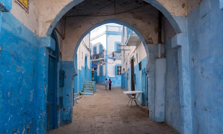 Street with arches in Larache, Morocco