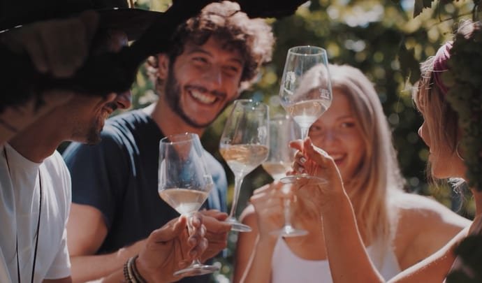 Family drinking wine in Italy
