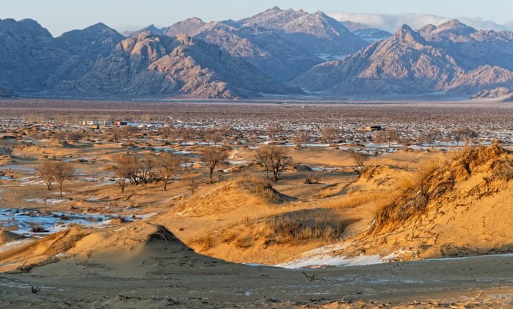 mountains and sand dunes in bayangobi in mongolia