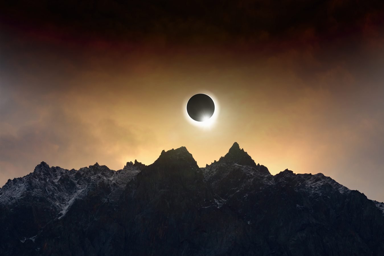Solar eclipse over the mountains