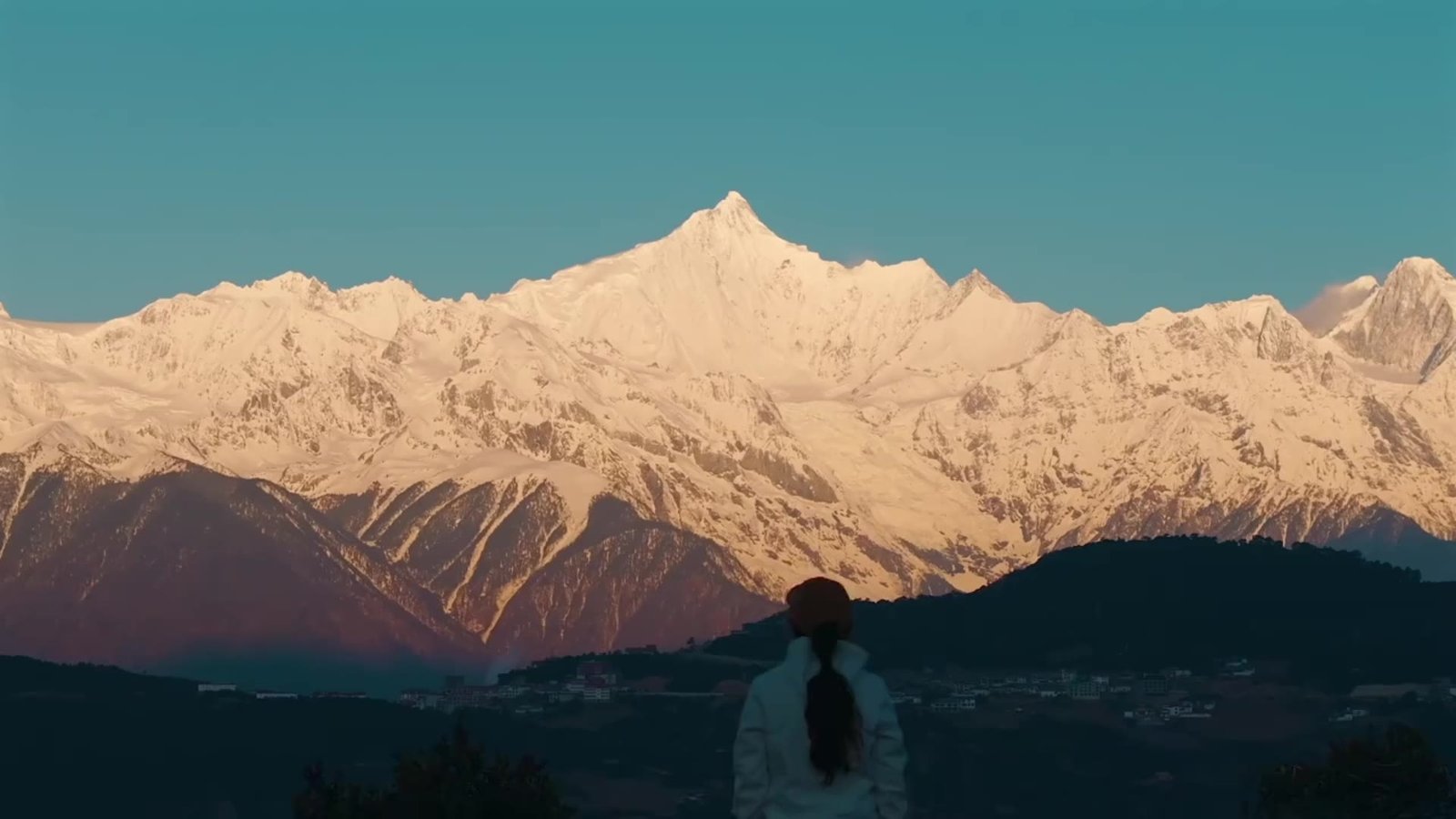 Snow-covered peaks glowing in the morning light in Yunnan